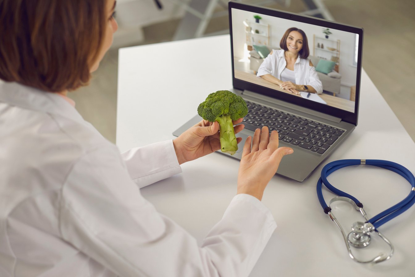 Online Dietitian Having Telemedicine Consultation with Her Patient via Video Call